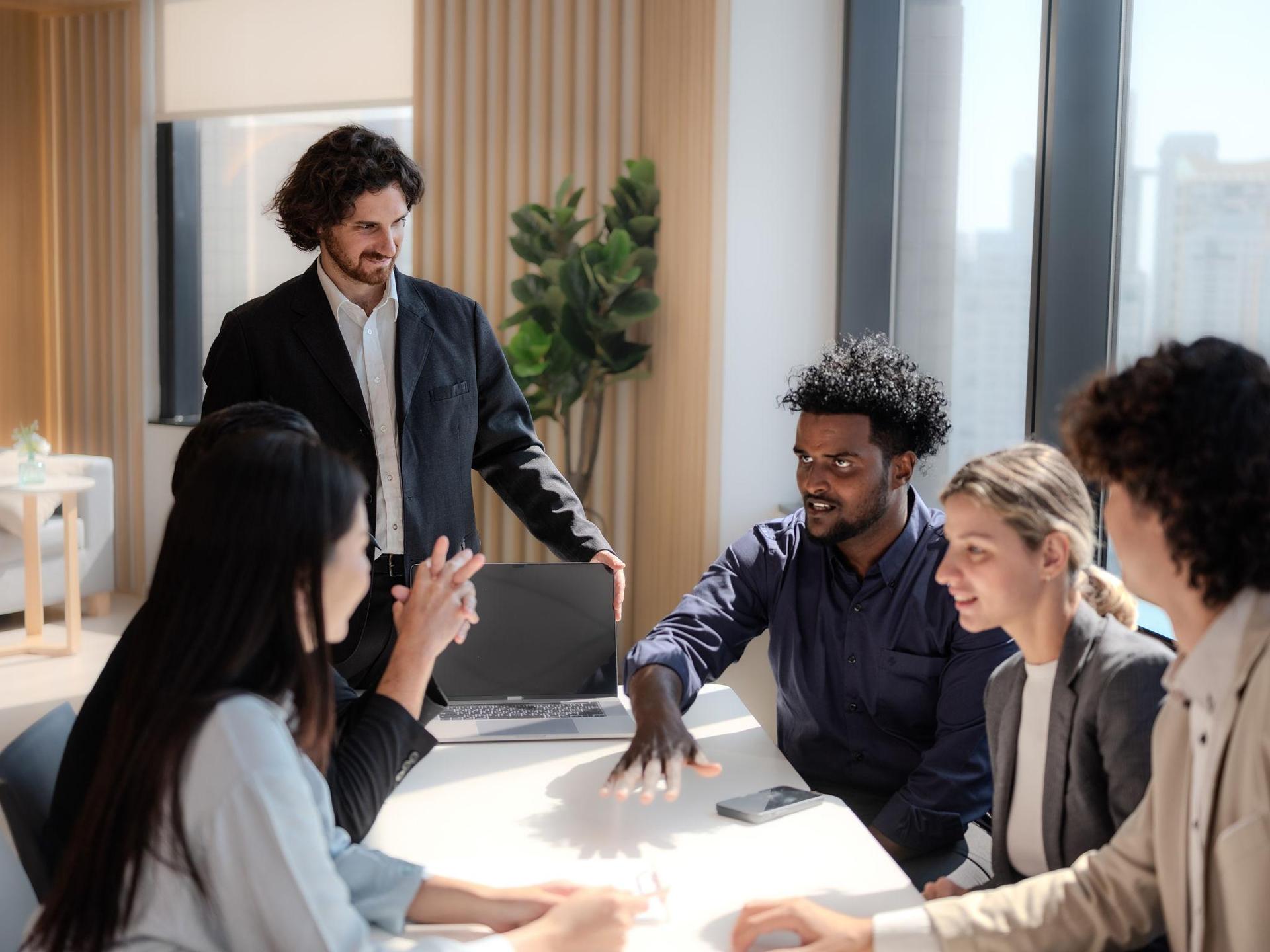 Ubique Systems consultants collaborating in an office